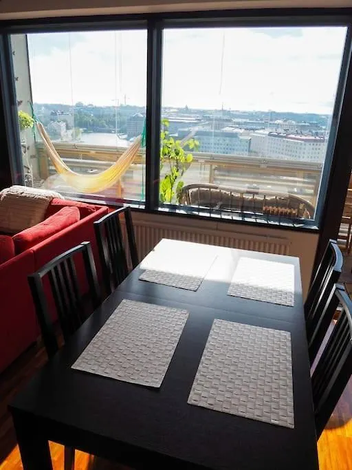 Sunset Views Over Helsinki Rooftops Apartment